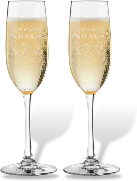 Two champagne flutes with engraved names, perfect for a personalized celebration or gift.